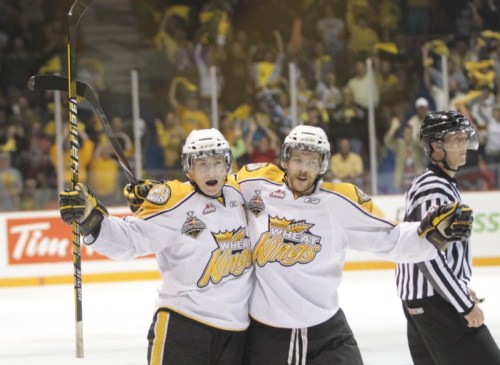 Tim Smith/Brandon Sun
Wheat Kings Matt Calvert, left, and Shayne Wiebe celebrate Calvert’s goal 
midway through the second period of Sunday’s final. The Wheaties’ lone goal of the night briefly cut the deficit to 3-1.