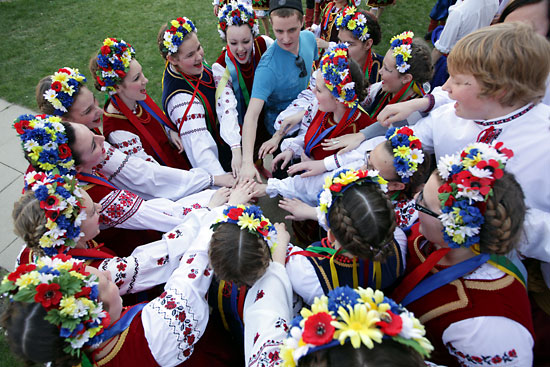 Tim Smith/Brandon Sun
Members of the Fisher Branch Chaika Dance Club crowd together for a cheer prior to performing.