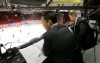 Bruce Bumstead/Brandon Sun
Play-by-play commentator Peter Loubardias, left, and colour-commentator Sam Cosentino, right, observe the skaters during warm-up at Westman Place.
(