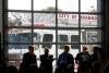 Bruce Bumstead/Brandon Sun
Guests at the grand opening of the new Brandon Number 1 Fire Hall were silhouetted against the large glass doors of the new station house on 19th Street North on Wednesday morning.