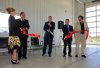 Bruce Bumstead/Brandon Sun
Linda Poole, left, and Fire Chief Brent Dane hold the ribbon with representatives from Bird Construction and Cibinel Architecture as Mayor Dave Burgess officially opens the new Brandon Fire and Emergency Services complex on 19th Street North on Wednesday.