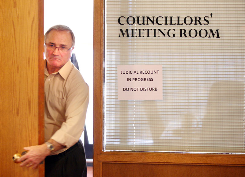 Colin Corneau/Brandon Sun
City clerk Con Arvisais exits a room at city hall during the judicial recount of the vote in Riverview ward on Tuesday afternoon. Len Isleifson was confirmed as the winner by two votes over incumbent Errol Black.