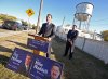 James O'Connor/Brandon Sun
Brandon West Progressive Conservative candidate Reg Helwer, at podium, and Brandon East candidate Mike Waddell, on Saturday morning outside the East End Community Centre, pledge five new police officers for the city if their party forms a government after the Oct. 4 election.