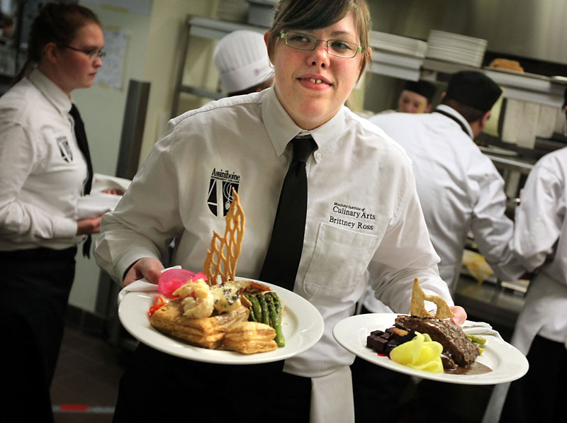File photo
Culinary arts student Brittney Ross carries some of the gourmet meals to patrons during the 2011 edition of the Grey Owl restaurant at Assiniboine Community College’s North Hill campus.