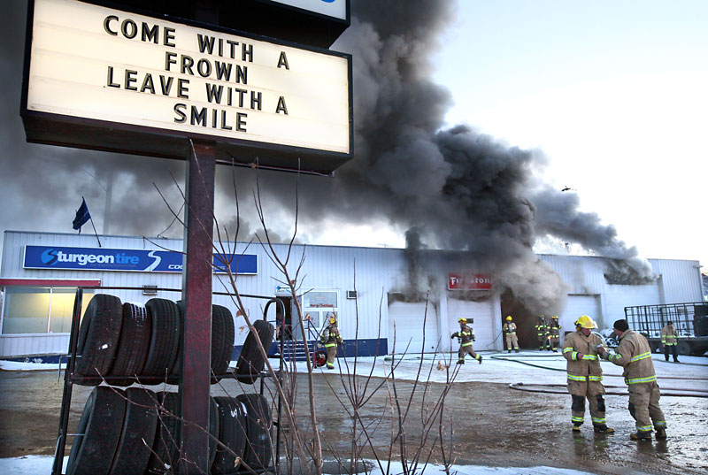 Colin Corneau/The Brandon Sun
Firefighters work to contain the blaze earlier in the day.