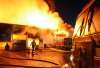 Colin Corneau/The Brandon Sun
Flames leap from the Sturgeon Tire building at the corner of First Street and Pacific Avenue during a blaze that continued into Monday evening.