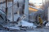 Bruce Bumstead/Brandon Sun
A firefighter directs water at one of the remaining hot spots on Tuesday morning following Monday’s fire that destroyed the Sturgeon Tire building at the corner of First Street and Pacific Avenue.