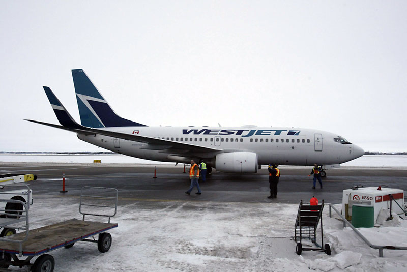 File photo
In this January 2006 photo, ground crew ready the first regular scheduled passenger jet in four years at the Brandon Municipal Airport for takeoff. The Air Transat Holidays charter flight was headed to Cancun, Mexico, with 40 people from Brandon aboard. An online petition in support of WestJet expansion to Brandon has garnered more than 2,600 signatures.