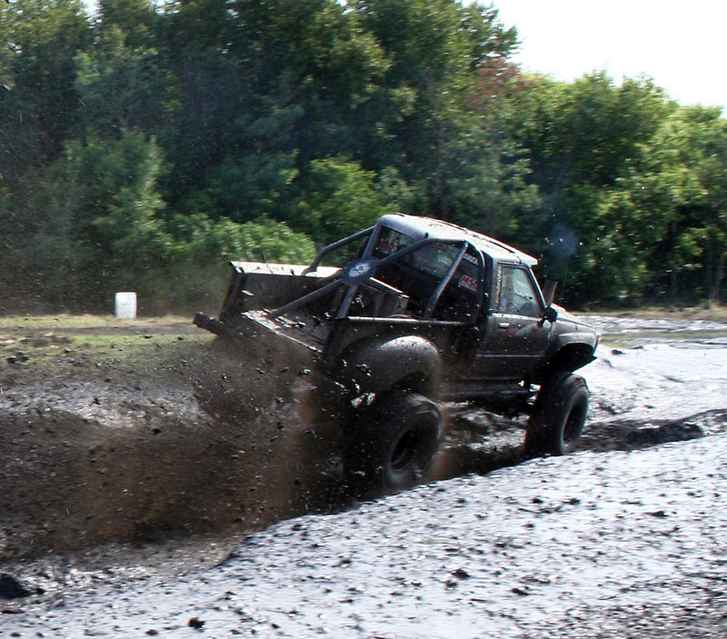 Robin Booker/Brandon Sun
A mud bog truck speeds through the course at the Douglas Mud Bog on Saturday. Around 200 people turned out for the event.