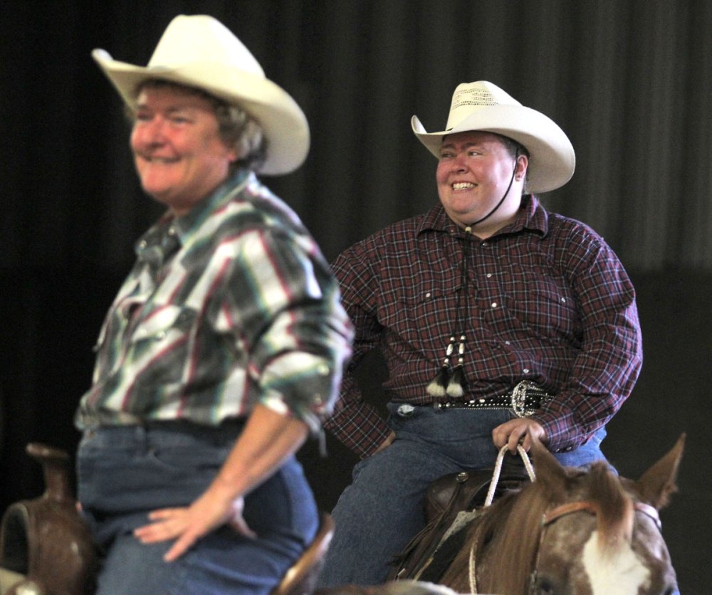 Colin Corneau
Fellow barrel racers are all smiles on Thursday.