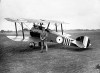 File
￼Dauphin-born William (Billy) Barker poses with an airplane in this undated photo. The First World War ace and recipient of the Victoria Cross was an early pioneer of aerial battle tactics during the war. He’d taken up flying to get out of the trenches, having signed up as a calvaryman but finding little use for horses on the battlefields of Europe.