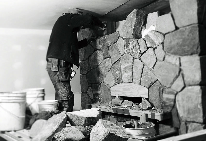 Karly McRae/For the Sun
Mason Matthew Kroeker works on building the giant hearth in the Foxtail’s second location in the town of Wasagaming. This fireplace will cook pizzas in less than 90 seconds. Foxtail Clear Lake, which opens tomorrow, is located in the historic Scrase’s building.