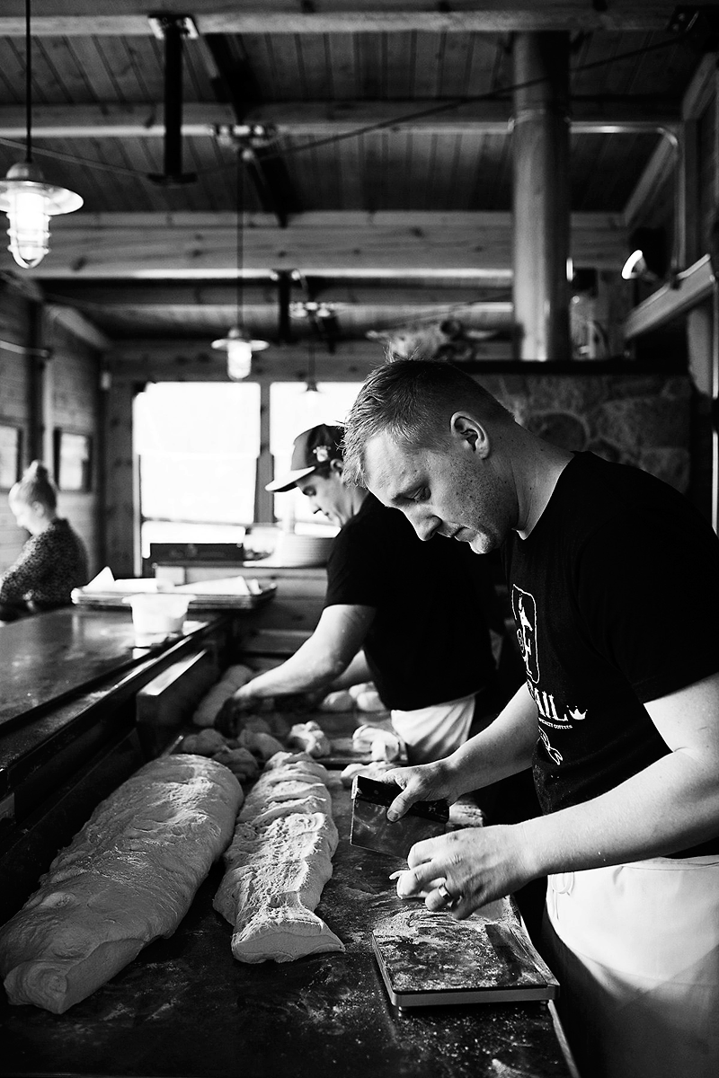 Karly McRae/For the Sun
Restaurateur Tyler Kaktins (right) works his wood-fired pizza magic in the original Foxtail Cafe on Highway 10 near Onanole.