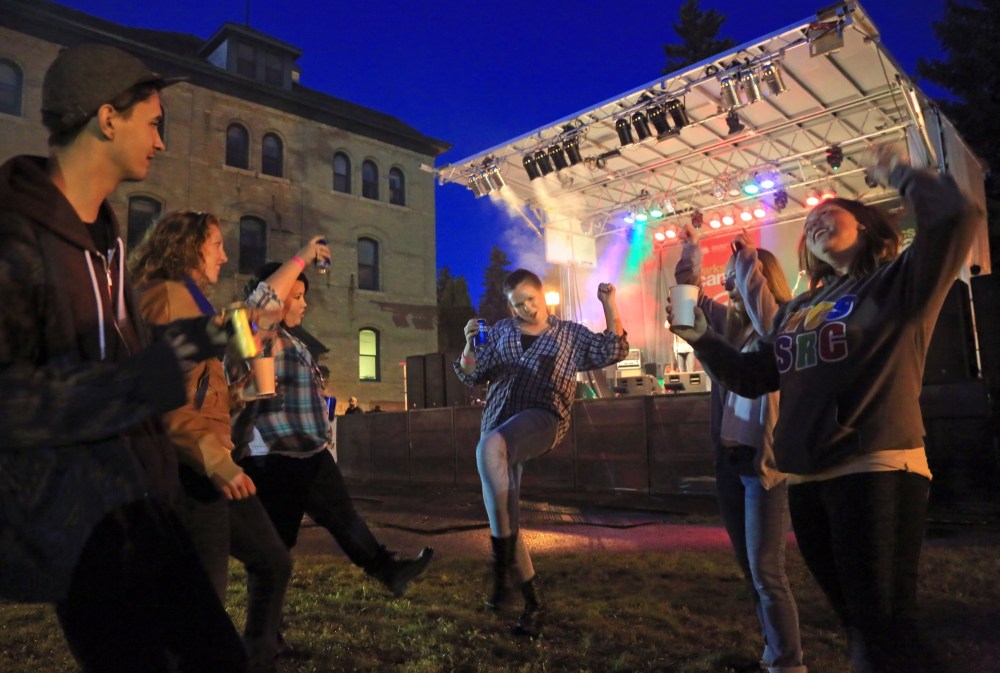 Colin Corneau/Brandon Sun
A group of students brave the dance area during the Crash the Courtyard event, Friday evening at Brandon University. The BUSU-organized concert brought Aaron Pritchett along with 5 local bands for a welcome-back to the new academic year.