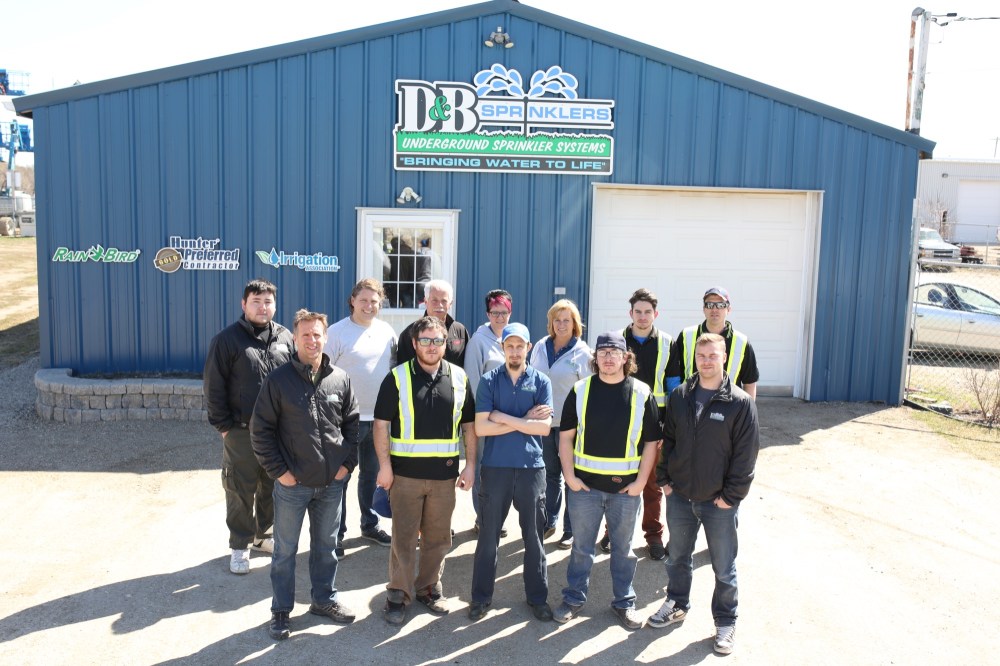 Tim Smith/The Brandon Sun
Owners Todd Gudz (second from left) and Jeff Fawcett (third from left) and their staff in front of D&B Sprinklers in Brandon.