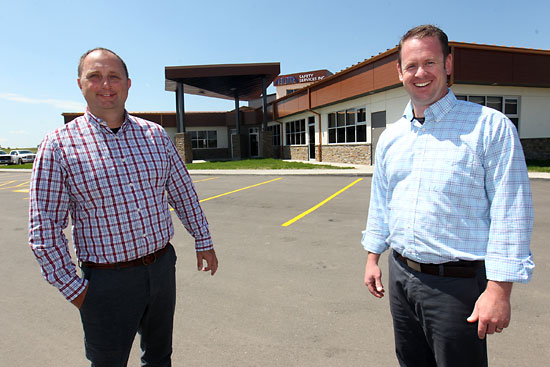 File
Elite Safety Services’ Darren Brick and Marc Watt stand outside their new training facility on 17th Street East earlier this year.
