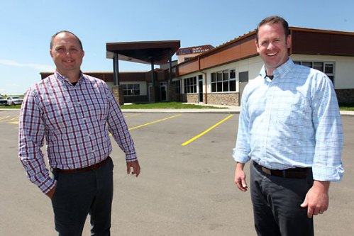File
Elite Safety Services’ Darren Brick and Marc Watt stand outside their new training facility on 17th Street East earlier this year.