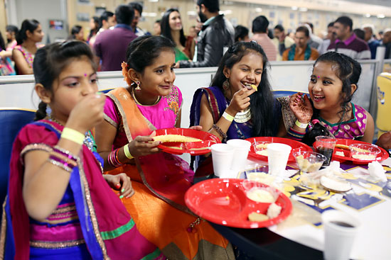 Tim Smith/The Brandon Sun
Bhakti Patel, Mahee Patel, Kermi Patel and Vishva Patel enjoy a meal while celebrating Navratri at the Brandon University Healthy Living Centre on Sunday evening.