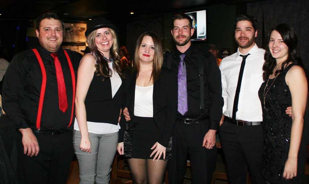Mariah Phillips/For The Sun
Greg Mashinter, left, Patti Mashinter, Melody Swidnicki, Kyle Swidnicki, Danielle Mailhot and Steven Lopes celebrate New Year’s Eve at The Dock on Princess.