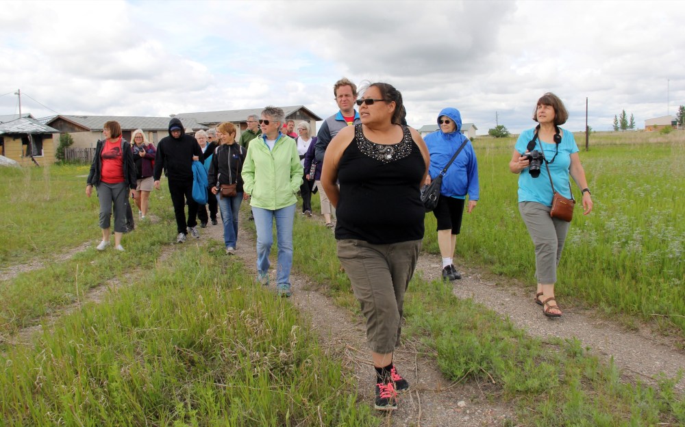 Ian Froese/The Brandon Sun
Members from the Presbyterian Church in Canada take a walking tour of Birdtail Sioux First Nation Saturday, led by community member Melody Bearbull, as part of the church's Healing and Reconciliation National Tour.