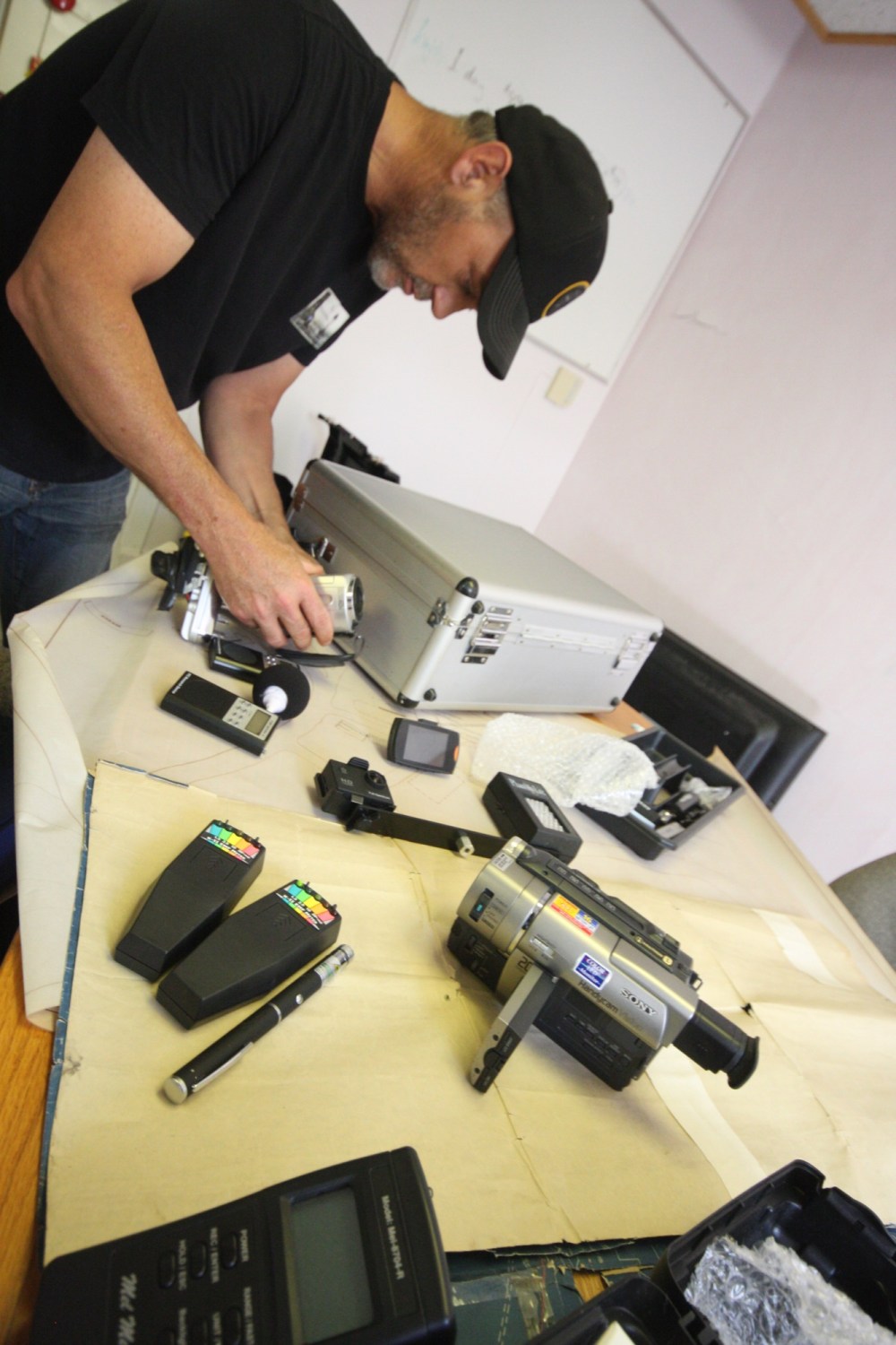 Tyler Clarke/The Brandon Sun
Saskatchewan and Maritime Paranormal Society founder Brad Monks looks over his paranormal investigation gear in a room at the Ninette Sanatorium administrative building on Saturday.