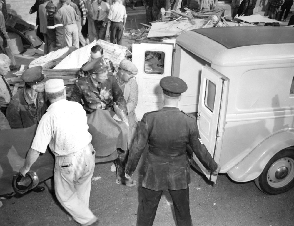 Jack Tennant/The Brandon Sun
Police load an employee from the Manitoba Power Commission in Brandon following a deadly steam plant blast in 1957.