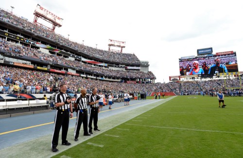Mark Zaleski/The Associated Press
Officials stand on the sideline of the Seattle Seahawks during the playing of the national anthem before an NFL game between the Seahawks and the Tennessee Titans on Sunday, in Nashville, Tenn. Neither team came out onto the field for the anthem.
