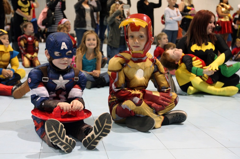 Ian Froese/The Brandon Sun
Micah Mercer, 5, as Captain America and Jack Johnson, 7, as Iron Man take a break   from crime-fighting to join the Be A Superhero in the Fight Against Cancer world record attempt in the Keystone Centre’s Manitoba Room on Sunday.