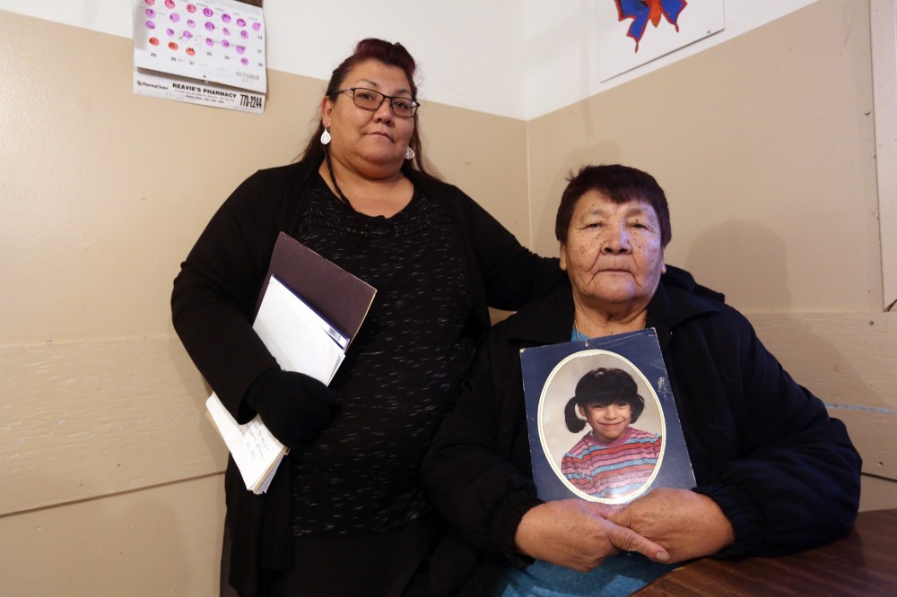 Michael Lee/The Brandon Sun
Bernadette Sumner, left, and her mother Mary Cook with a photo of their sister and daughter, respectively, Amanda Jane Cook, who was murdered 21 years ago.
