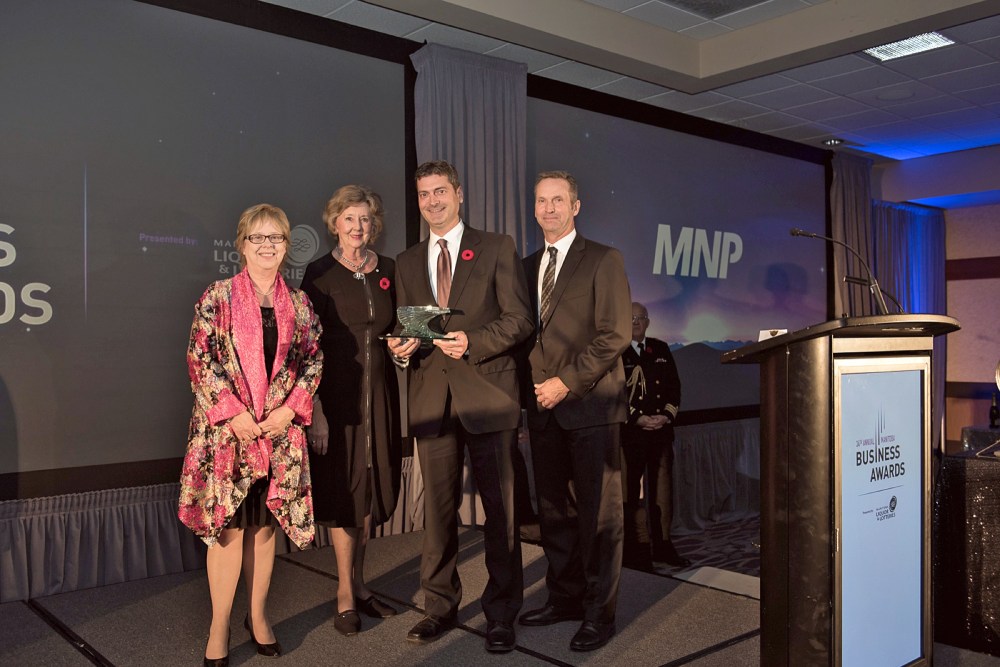 Submitted
MNP regional managing partner Andrew Stibbard, second from the right, receives the Lieutenant Governor’s Award for Outstanding Contribution to the Community by a Business during the Manitoba Chambers of Commerce Business Awards gala in Winnipeg on Friday. From left is Manitoba Chambers of Commerce board chair Judy Murphy, Manitoba Lt.-Gov. Janice Filmon, Stibbard and Bell MTS and Western Canada vice-chair Dan McKeen.