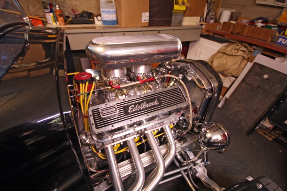 Tyler Clarke/The Brandon Sun
The exposed engine of the 1932/34 Ford hot rod, glistening under the glow of the lighting of Ron Baryluk’s heated garage.