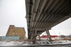 Tim Smith/The Brandon Sun
The brick Kullberg's Furniture building and Advance Auto Body & Glass are framed by the Daly Overpass. Proposals for the new overpass could involve appropriating land from local businesses such as the two mentioned above.