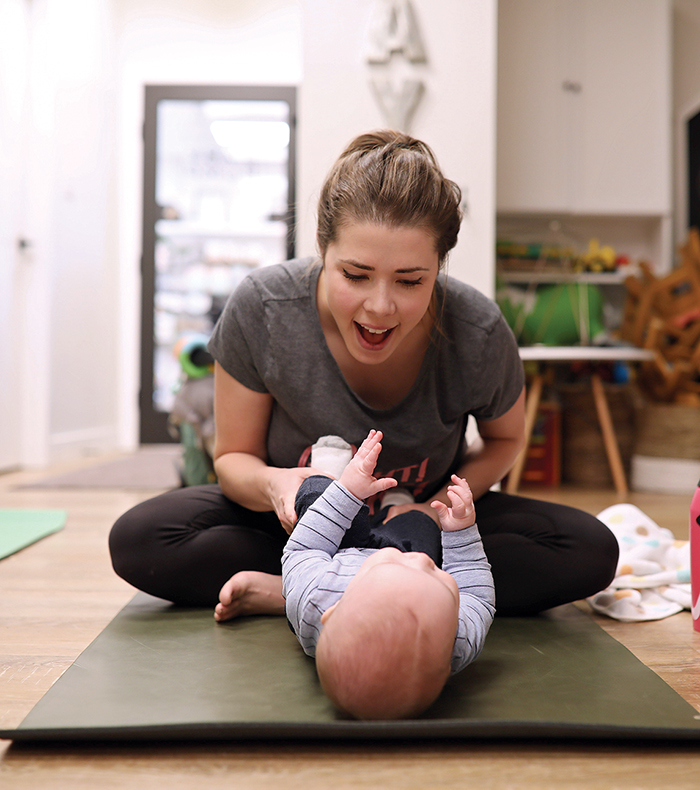 Jen Hart (C) and her son Ty take part in a Me and Mini Me yoga class at Baby Bump on 18th Street.
(Tim Smith/The Brandon Sun)