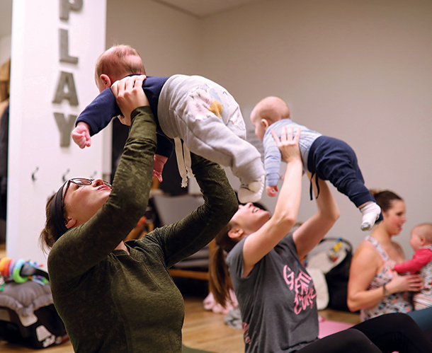 Arleigh Andrushak lifts her son Jackson while taking part in a Me and Mini Me yoga class at Baby Bump on 18th Street.
(Tim Smith/The Brandon Sun)