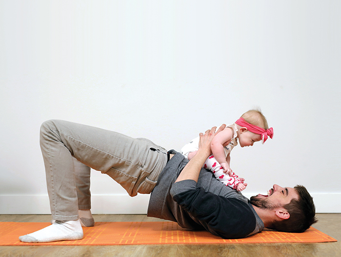 Braden Whiting visits with his ten-month-old daughter Kynlee during a Me and Mini Me yoga class at Baby Bump on 18th Street.
(Tim Smith/The Brandon Sun)