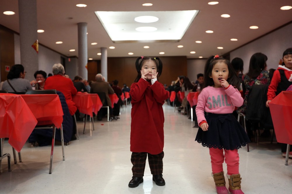 Michael Lee/The Brandon Sun
Three-year-old girls Mingyi Wang, left, and Nina Bao stop for a photo during Chinese New Year celebrations at the Western Manitoba Centennial Auditorium.