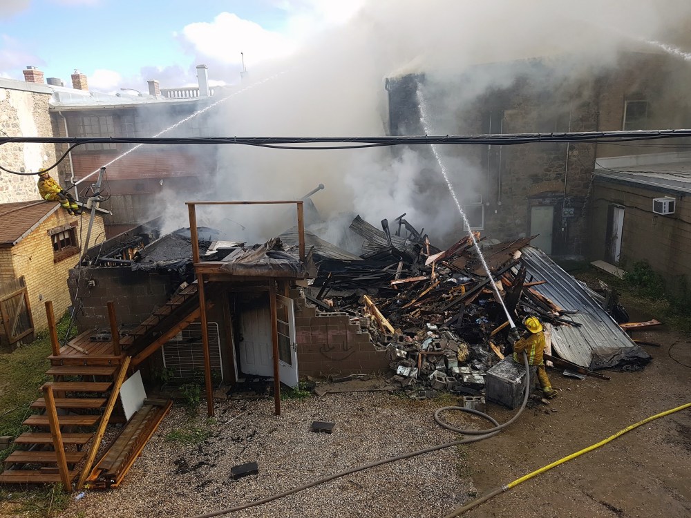 Submitted
On Sept. 23, 2017, firefighters battle the blaze that decimated Seventh Avenue storefronts in Virden. The electronics store owned by Reny Kitto is seen in the foreground.