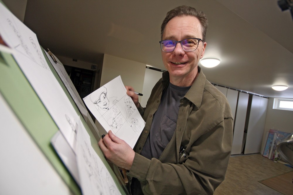 Tyler Clarke/The Brandon Sun
Local cartoonist Curt Shoultz is seen with a page from his new creation, Brandoon, which will grace Saturday editions of The Brandon Sun from this point forward. The comic will replace his previous creation, Stack Catz, which ran for the past six months to last week’s edition. This page features one of his new characters, who goes by the name T.