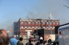 Michael Lee/The Brandon Sun
A crowd gathers to watch as firefighters put out a fire at the Massey Manor building on Pacific Avenue.