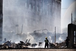 MATT GOERZEN/THE BRANDON SUN
Firefighters continued to douse the ruined remains of the Christie