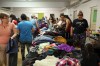 Michael Lee/The Brandon Sun
Displaced residents from Massey Manor look through donated clothing at St. Matthew's Cathedral on Monday.