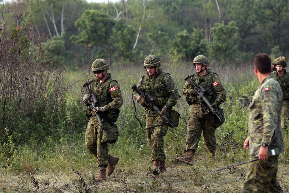Soldiers from 2nd Battalion, Princess Patricia's Canadian Light Infantry head to their next event during a skills competition at CFB Shilo on Friday. (Michael Lee/The Brandon Sun)