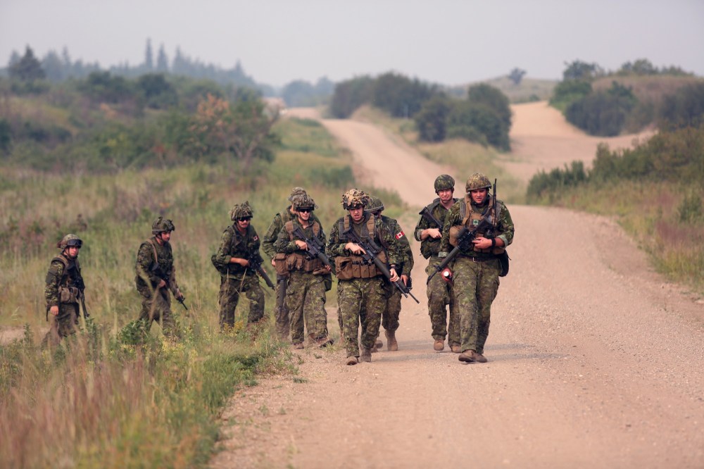 A group from 2nd Battalion, Princess Patricia's Canadian Light Infantry walks along a dirt road Friday at CFB Shilo. (Michael Lee/The Brandon Sun)