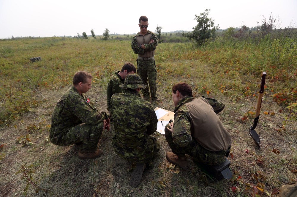 Soldiers from 2nd Battalion, Princess Patricia's Canadian Light Infantry mark their positions during a skills competition at CFB Shilo on Friday. (Michael Lee/The Brandon Sun)