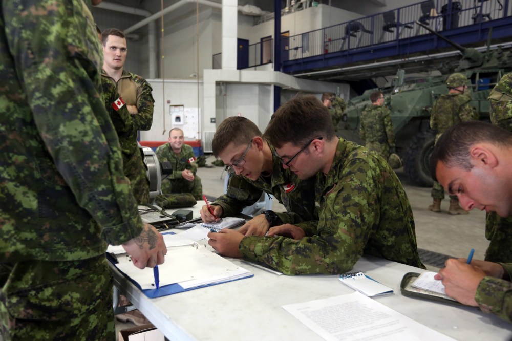Soldiers perform a radio examination Friday at CFB Shilo as part of a skills competition involving members of 2nd Battalion, Princess Patricia's Canadian Light Infantry. (Michael Lee/The Brandon Sun)