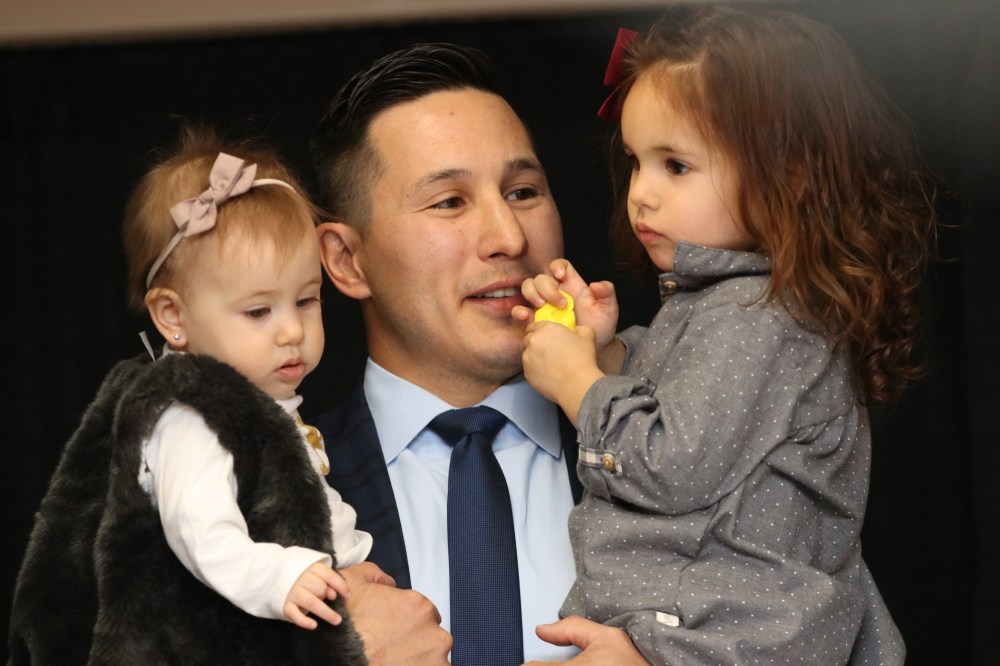 Former Brandon Wheat King Jordin Tootoo poses with daughters Siena Rose, 2, and baby Avery Grace after announcing his retirement from the National Hockey League in Brandon on Friday.