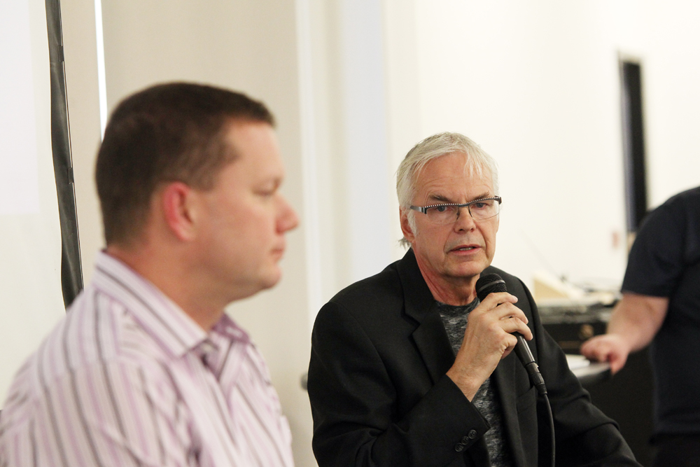 Coun. Barry Cullen (right) and James Montgomery speak at a candidates' forum Wednesday at Brandon University. (Michael Lee/The Brandon Sun)