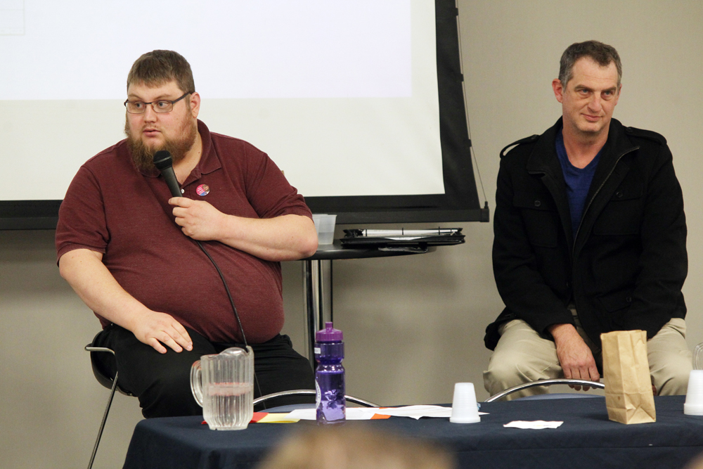 South Centre ward candidates Nick Brown, left, and Bruce Luebke speak at a candidates' forum at Brandon University on Wednesday. (Michael Lee/The Brandon Sun)