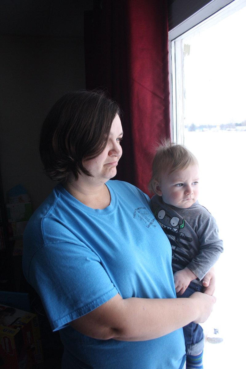 Kerri Clearsky holds her grandson, Kailem, in her arms. Clearsky has been told she and her family have seven months to leave their home of 11 years. (Bud Robertson/The Brandon Sun)