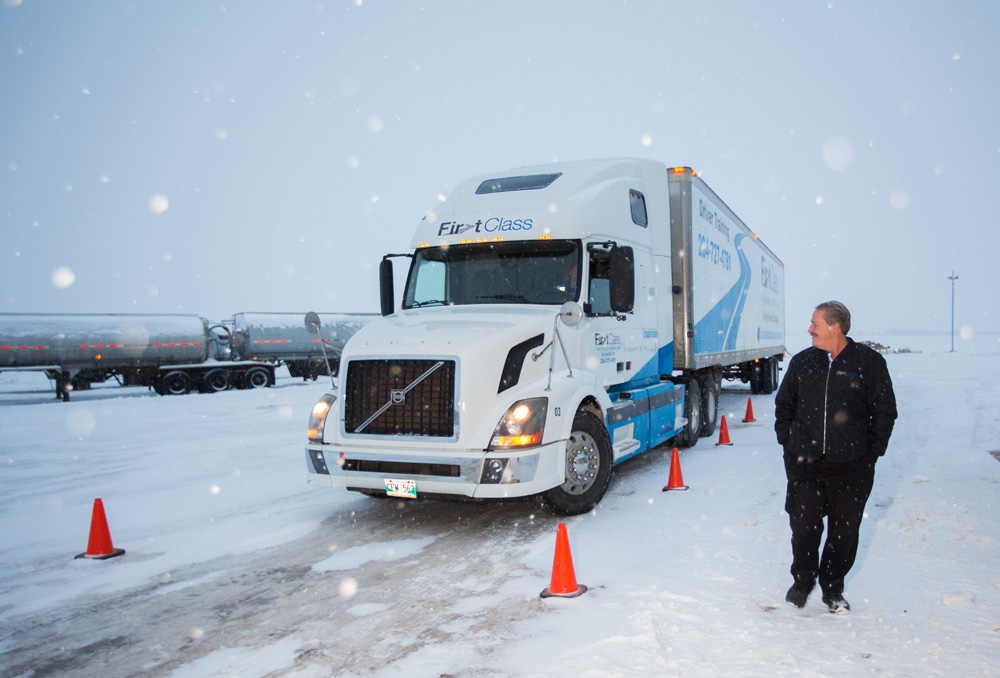 First Class Training Centre Inc. president and general manager Jim Campbell  watches a student in training drive at their location in Cornwallis on Wednesday. (Chelsea Kemp/The Brandon Sun)